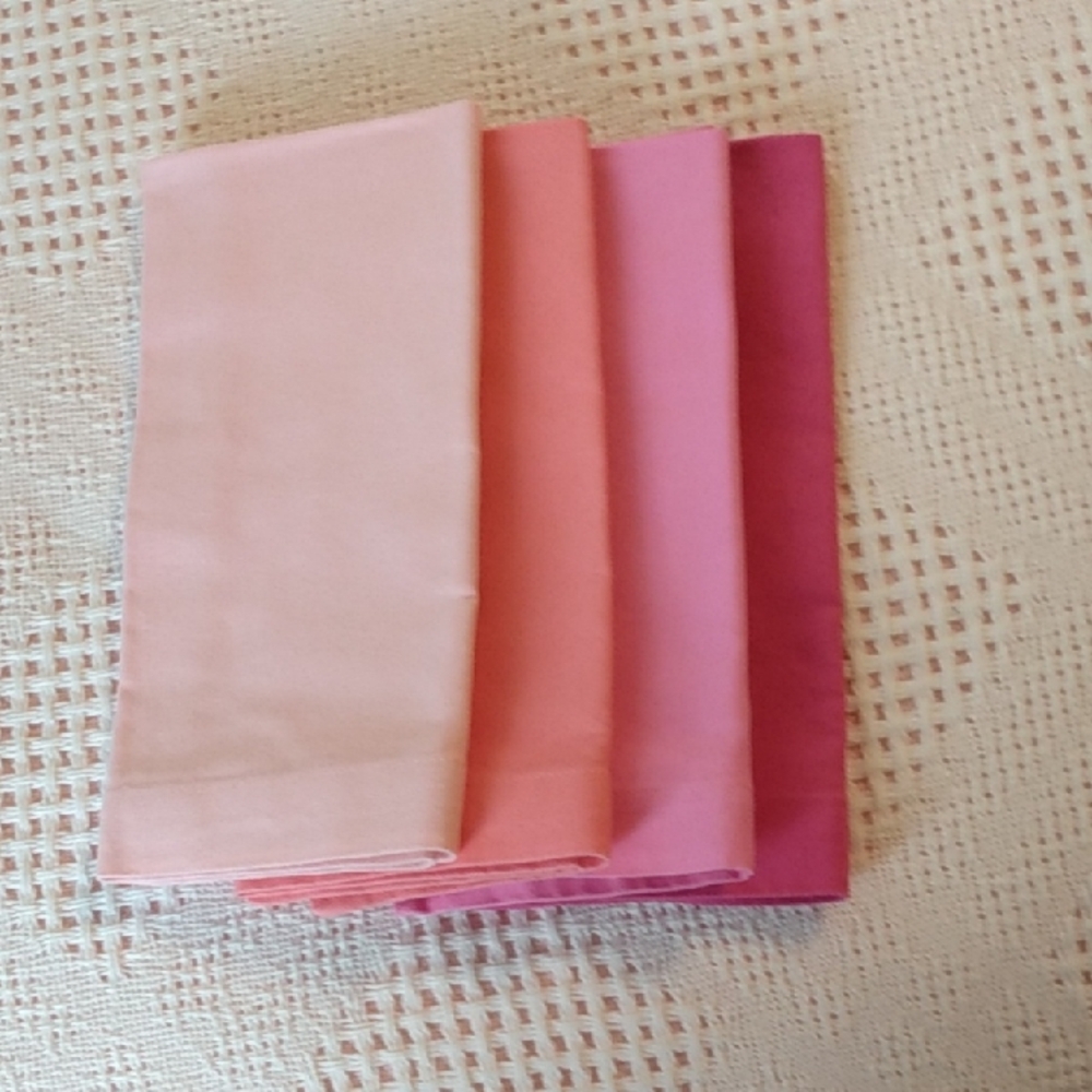 Set of Eight Napkins.  Two Each In Shades Of Pink And Peach